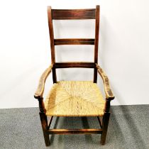 A 19th C oak rush seat country chair, H. 110cm.