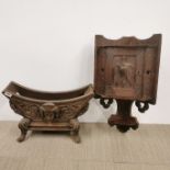 A large carved antique oak plate stand, W. 53cm, together with a carved oak corner cabinet.