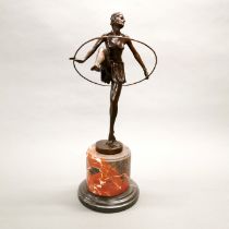 An Art deco style bronze figure of a hoop girl on a marble base, H. 48cm.