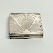 A Tiffany & Co sterling silver Art Deco cigarette case, 9 x 8 x 1.5cm.