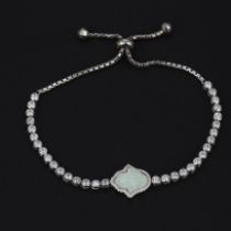 A 925 silver bracelet set with a carved Hamsah hand shaped opal and white stones, largest internal