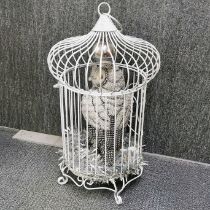 A painted ornamental metal bird cage with a jewelled figure of an owl, H. 70cm.