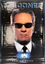 Two double-sided printed plastic cinema posters, one for Men In Black, 119 x 173cm together with a..