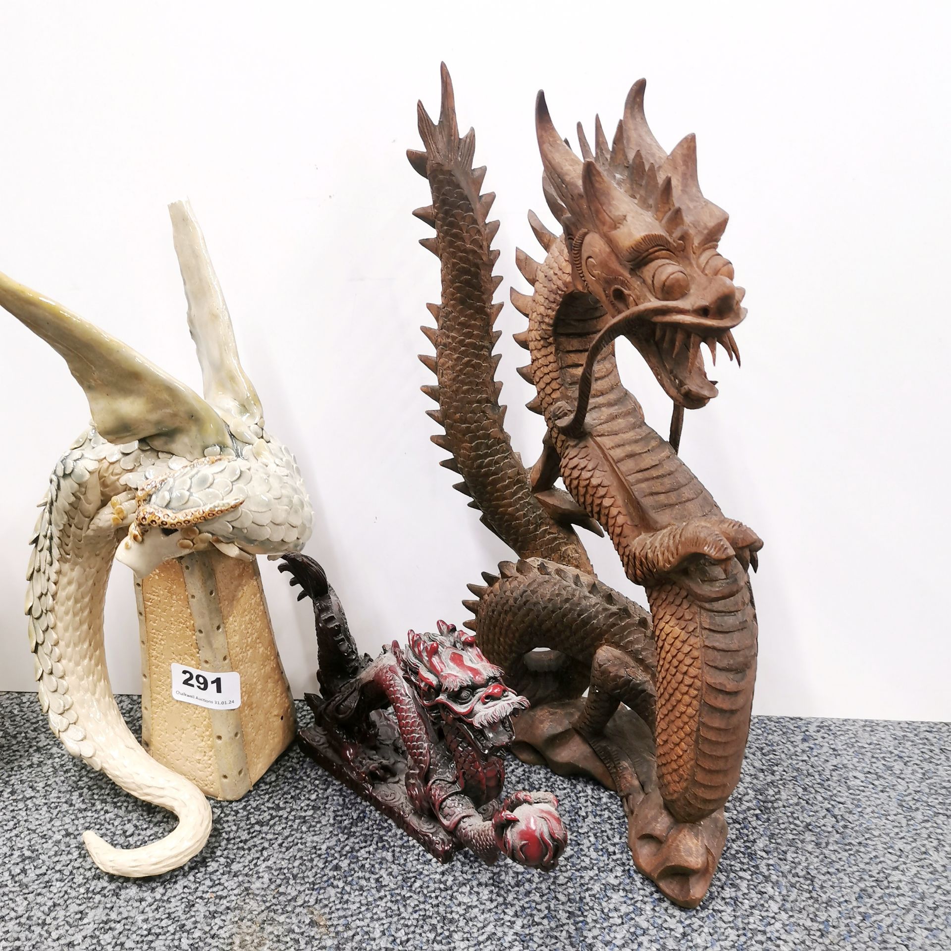 Two glazed pottery figures of dragons by Karen Lainson, H. 30cm, together with a carved wooden - Image 2 of 3