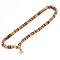 A strand of Tibetan human skull prayer beads.