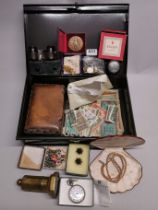 A box of mixed interesting items including a trench art lighter.