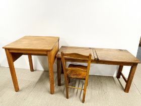 An old double oak school desk and chair together with a single desk.