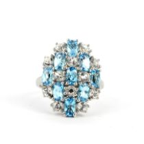 A 925 silver ring set with blue topaz and white spinels, (N.5).