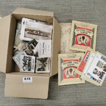 A quantity of vintage postcards, card books and cigarette cards.