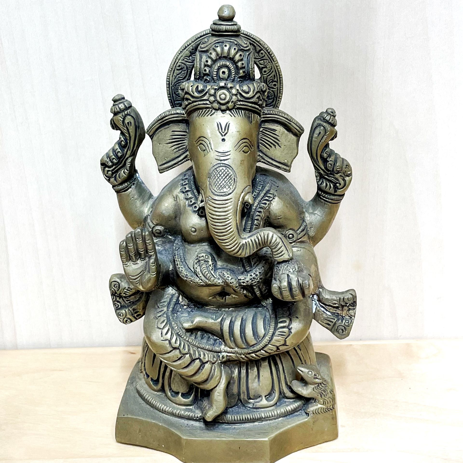 A heavy Indian figure of Ganesh, H. 19cm, together with a Himalayan bronze/brass guardian head - Image 3 of 4
