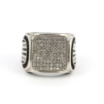 A 925 silver diamond set ring, (J.5). Bend to shank.