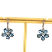 A pair of 925 silver flower shaped earrings set with oval cut London blue topaz and white stones, L.