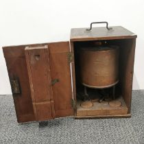 A cased copper burner, dated 1913, case H. 33cm.