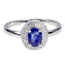 A 925 silver cluster ring set with oval cut sapphire and white stones, (P).