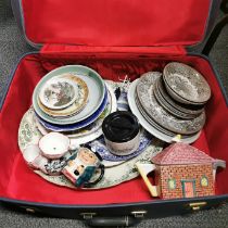 A vintage case and china contents.