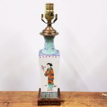 A 19th/early 20th C Chinese porcelain vase mounted as a table lamp on a carved hardwood base, H.