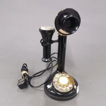 A continental stick telephone, part of earpiece missing.