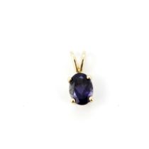 A 10ct yellow gold (stamped 10K) pendant set with an oval cut purple tourmaline, L. 1.2cm