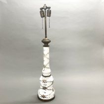 A 19th C hand painted milk glass and brass table lamp base, H. 84cm.