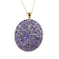 A large 925 silver gilt pendant set with oval cut tanzanites, L. 4.5cm, on a silver gilt chain, L.