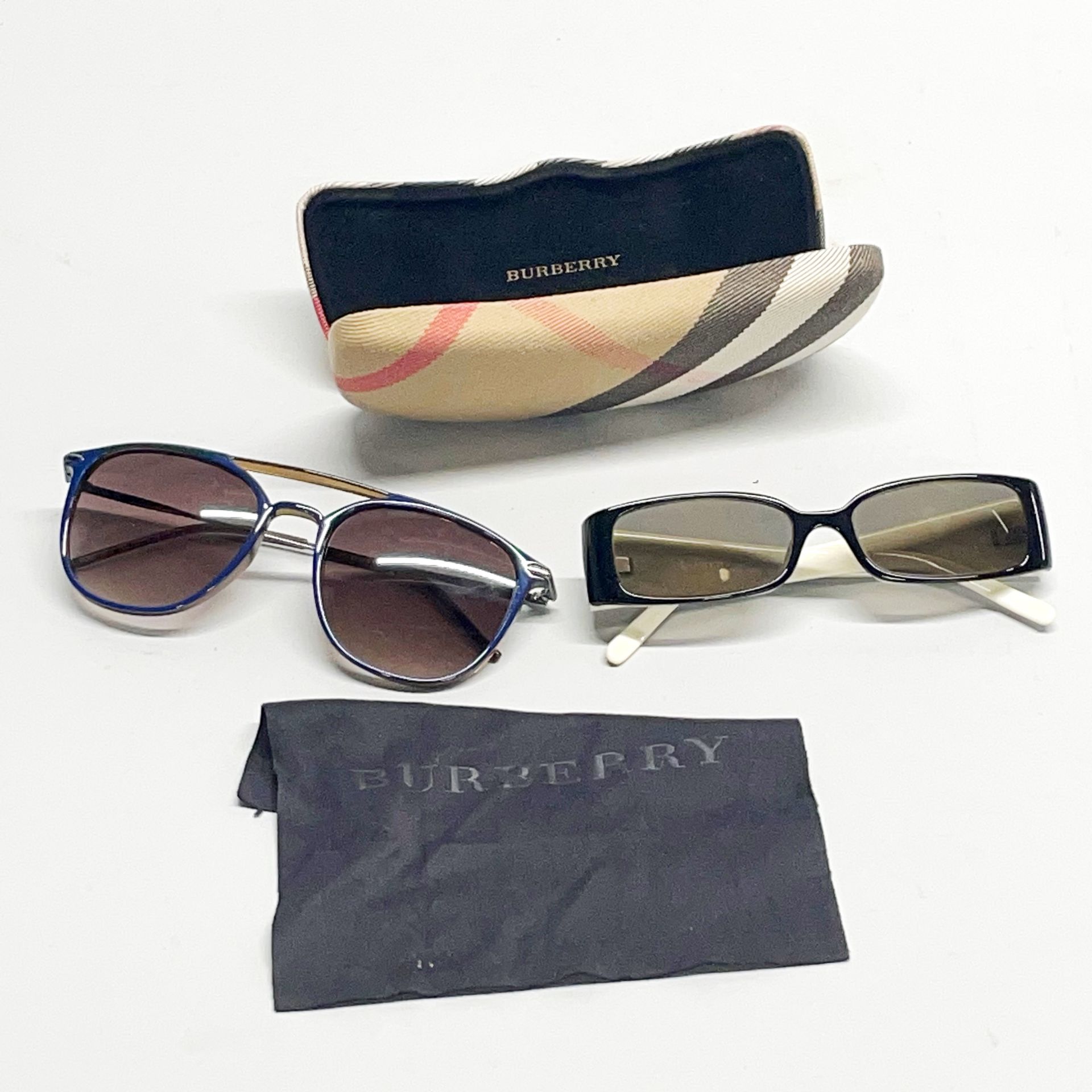 A pair of vintage Burberry sunglasses together with a pair of Ted Baker sunglasses.