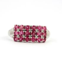 A 925 silver ring set with pink topaz and white topaz set shoulders, (O).