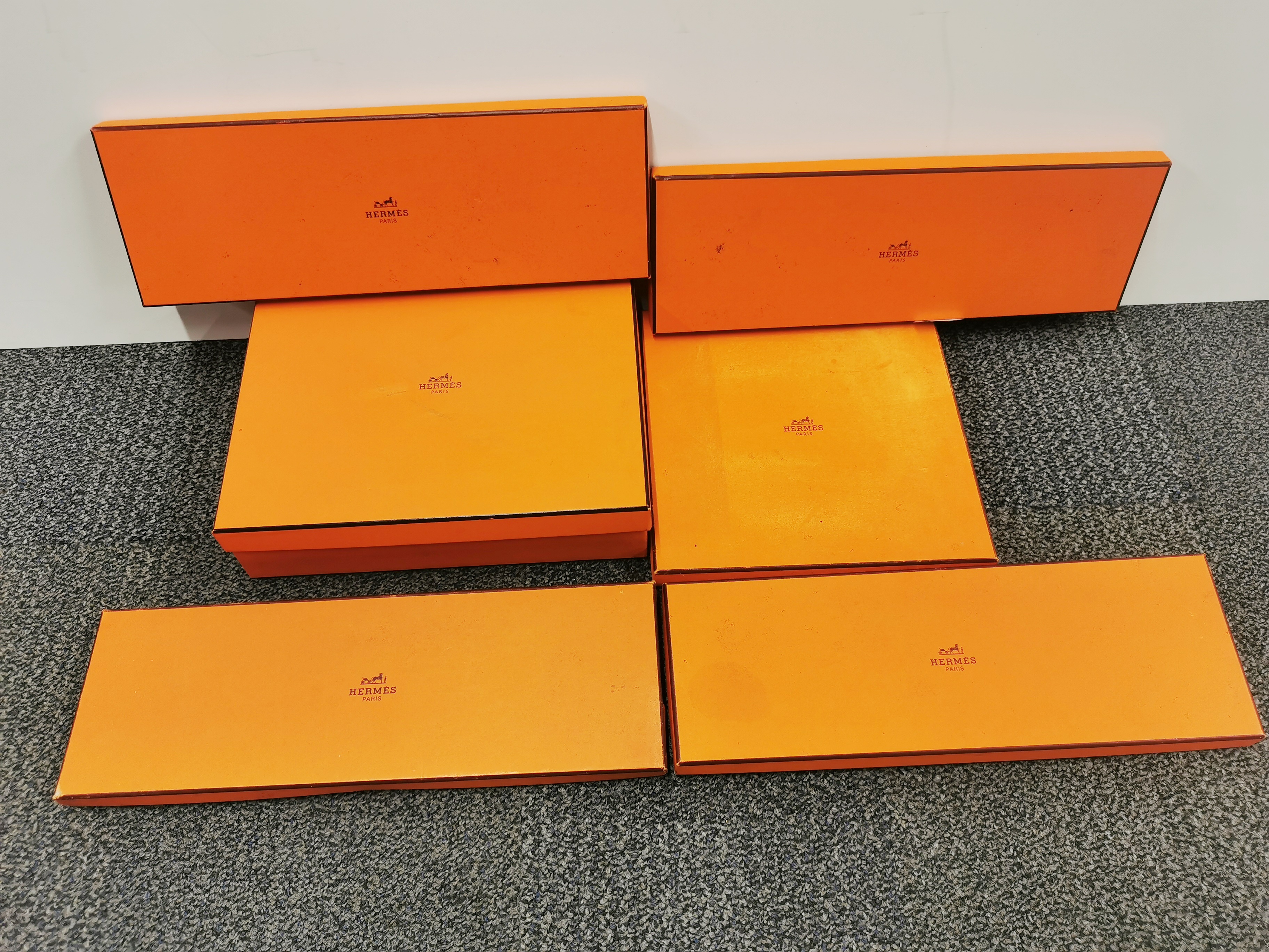 A group of six empty Hermes boxes.