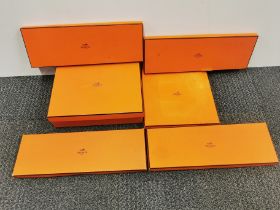 A group of six empty Hermes boxes.