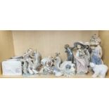 A large collection of Lladro, Nao and other porcelain figures, tallest H. 30cm.
