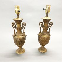 A pair of 19th/early 20th C bronze and brass urn style table lamp bases, H. 40cm.