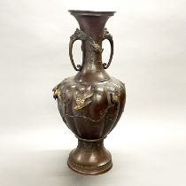 A large relief decorated 19thC Japanese bronze vase, H. 61cm. (slightly A/F to rim)