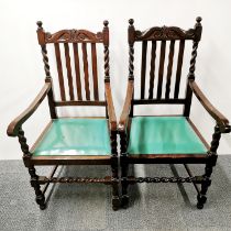 A pair of carved oak carver chairs with barley twist backs, H. 111cm.