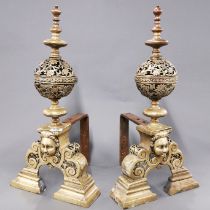 A pair of impressive 19thC brass and steel andirons, H. 64cm.