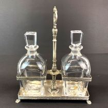 A silver plated decanter stand with two Kosta Swedish glass decanters. W. 25cm, H. 30cm.