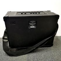 A Blackstar ID CORE stereo 40 speaker with carrying strap, 43 x 34 x 18cm.