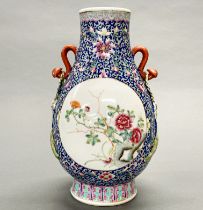 A finely decorated mid 20th C Chinese enamelled porcelain vase, previously drilled as a lamp base