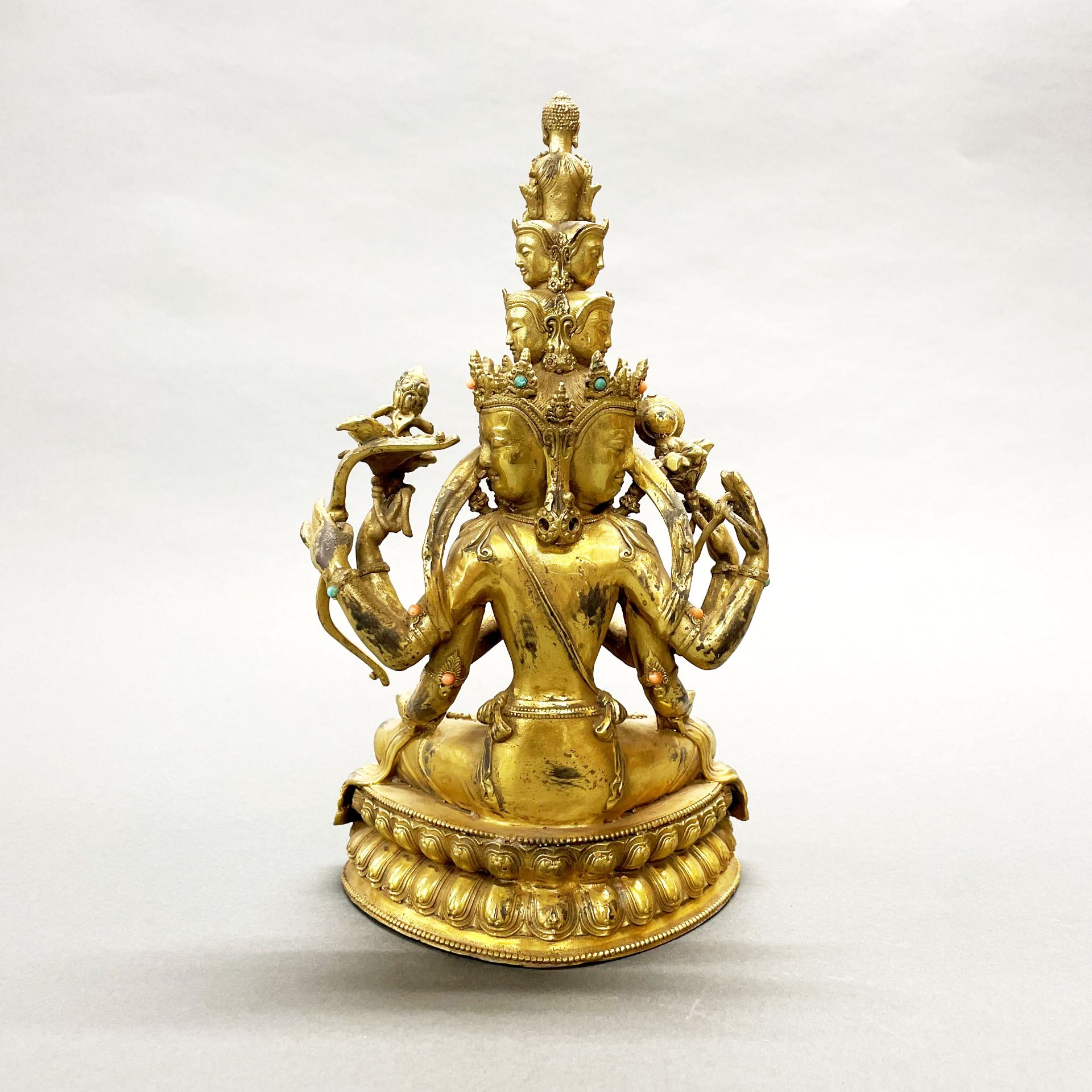 A Tibetan jewelled gilt bronze multi arm and multi head deity, H. 29cm. - Image 2 of 3