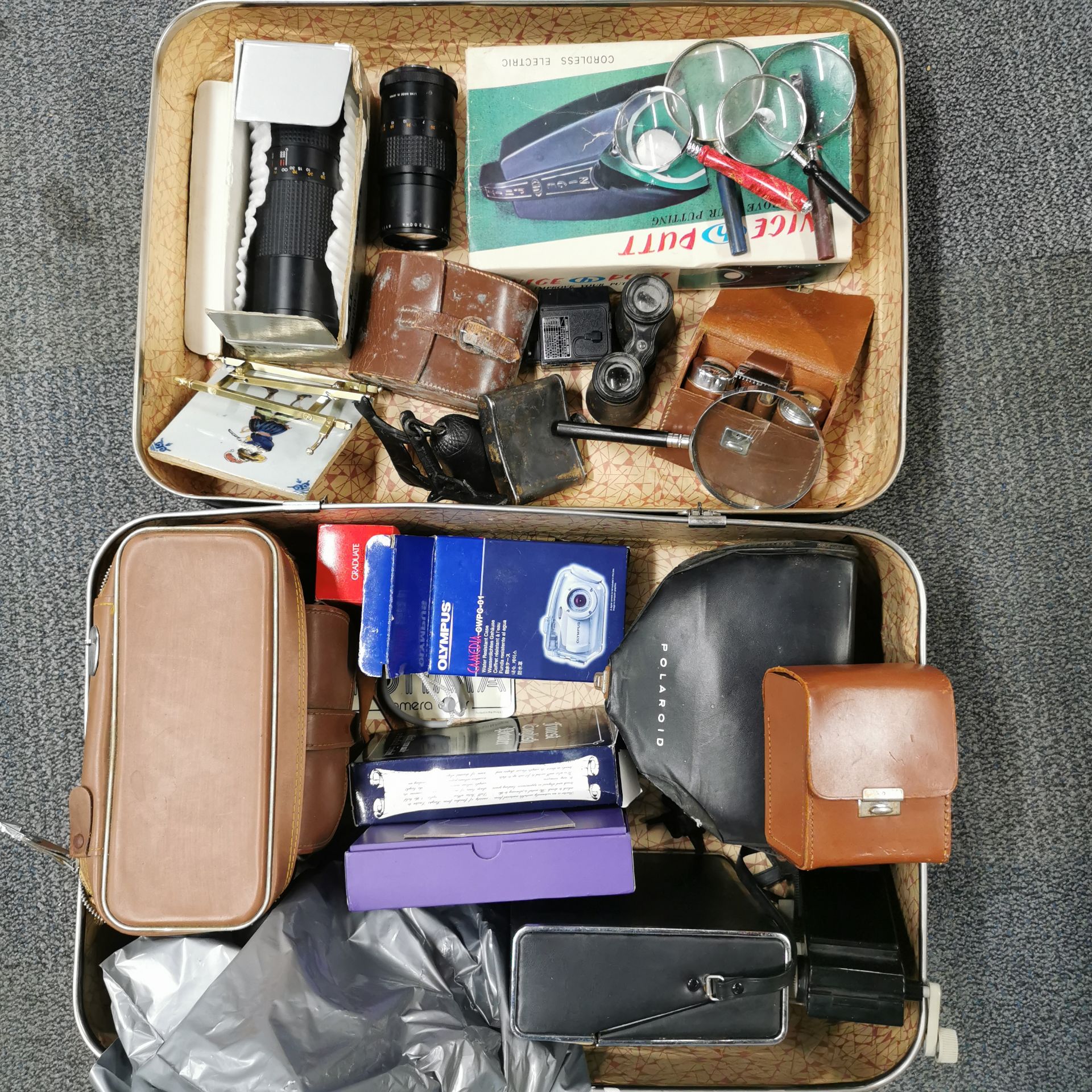 A vintage case of cameras, lenses, etc.