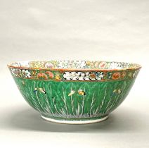 A large Chinese Canton enamelled porcelain bowl, Dia. 37cm, D. 15cm. Slight restoration.