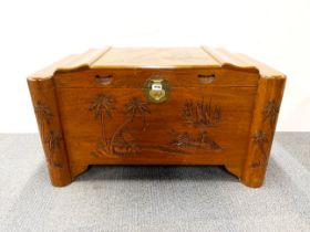 An oriental carved teak wood and camphor lined blanket box, W. 100cm, H. 57cm.