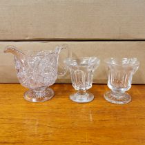 Two early blown glass custard cups and a Queen Victoria commemorative glass jug.