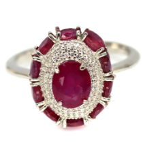 A 925 silver cluster ring set with oval cut rubies and white stones, (O).