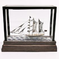 A cased filigree white metal sailing boat, cased size 23 x 10 x 19cm.
