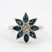A 925 silver flower shaped ring set with marquise cut London blue topaz and white stones, (O).