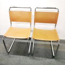 A pair of chrome and leather chairs in the style of designer Ludwig Mies van der Rohe, H. 86cm.