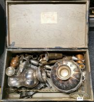A vintage case of mixed metalware.