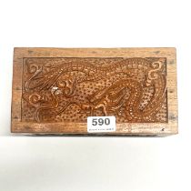 A Chinese carved wooden box and coin contents.