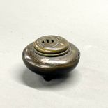 A Japanese bronze tsuba style lidded censer, 12 x 6cm (slightly a/f)