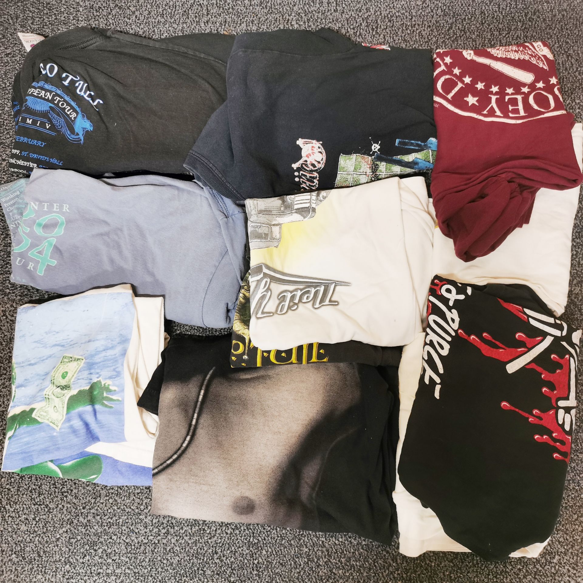 A collection of twelve mixed pop related t-shirts.