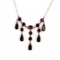 A 9ct rose gold necklace set with pear, round and oval cut tourmalines, L.